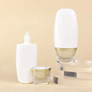 Şeffaf Altın Görünümlü Kapaklı Oval PE Bakım Şişesi – 50 ml